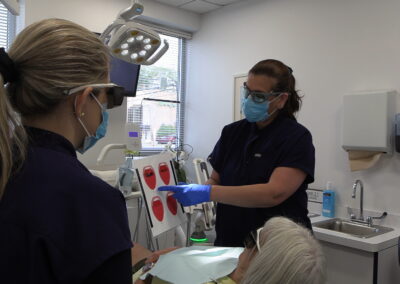 Dentist communicating with patient
